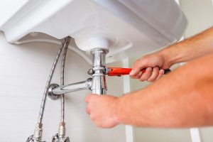photo-of-a-plumber-fixing-drainage emergency plumber in mt vernon