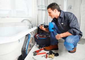 picture-of-a-professional-plumber-ny Picture of a professional plumber fixing bathtub