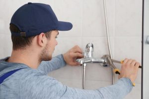 plumber-fixing-faucet Emergency Plumber in Jackson Heights
