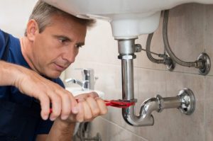 professional-plumber-repairing-sink-photo emergency plumber Albuquerque