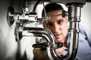 plumber-professionally-fixing-broken-sink-drainage plumber professionally fixing broken sink drainage