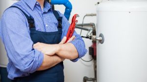 photo-of-a-plumber-poses-after-finsihing-job photo of a plumber poses after finishing job