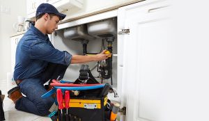 plumber-measuring-broken-pipes-photo plumber measuring broken pipes photo
