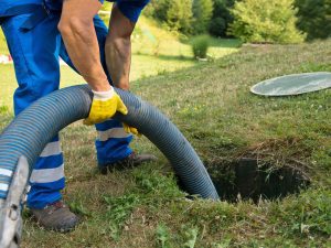 septic-tank-cleaning-by-a-plumber-photo septic pumping near me