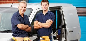 plumbers-posing-with-a-service-car-photo Emergency Plumber in Orange County, California