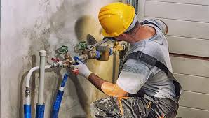 Picture of a technician performing pipe repair